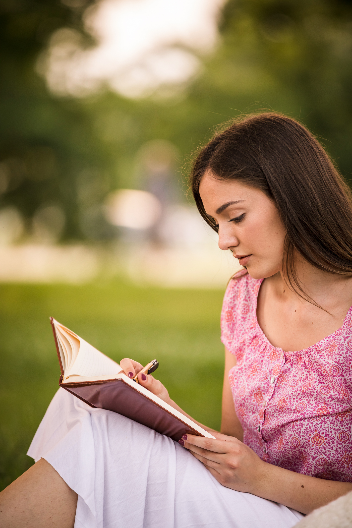 Young woman writing a letter.
