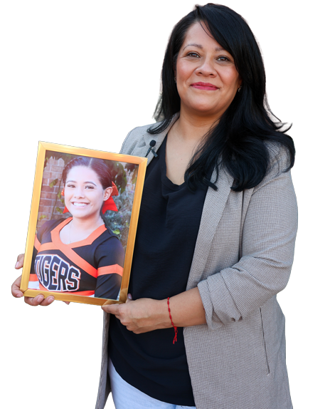 Donor mom, Rosa, holding a photo of her daughter